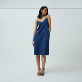 Saltpetre womens wear, indo-western slip dress in Indigo blue for semi formal, casual, occassional wear.
Comfortably elegant dress in indigo blue colour with delicate straps, back slit and side pockets.