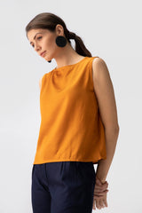 Saltpetre womens wear, indo-western shell top for semi formal, casual, occassional wear. Comfortably elegant woth delivate feminine straps in mustard yelow colour.