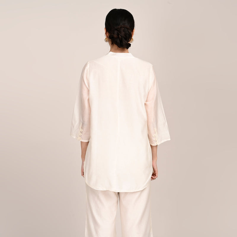 Sherry Single Pleated Split V Neck Tunic With Hand Embroidered Motif - Limited Edition - Pearl White Chanderi Silk