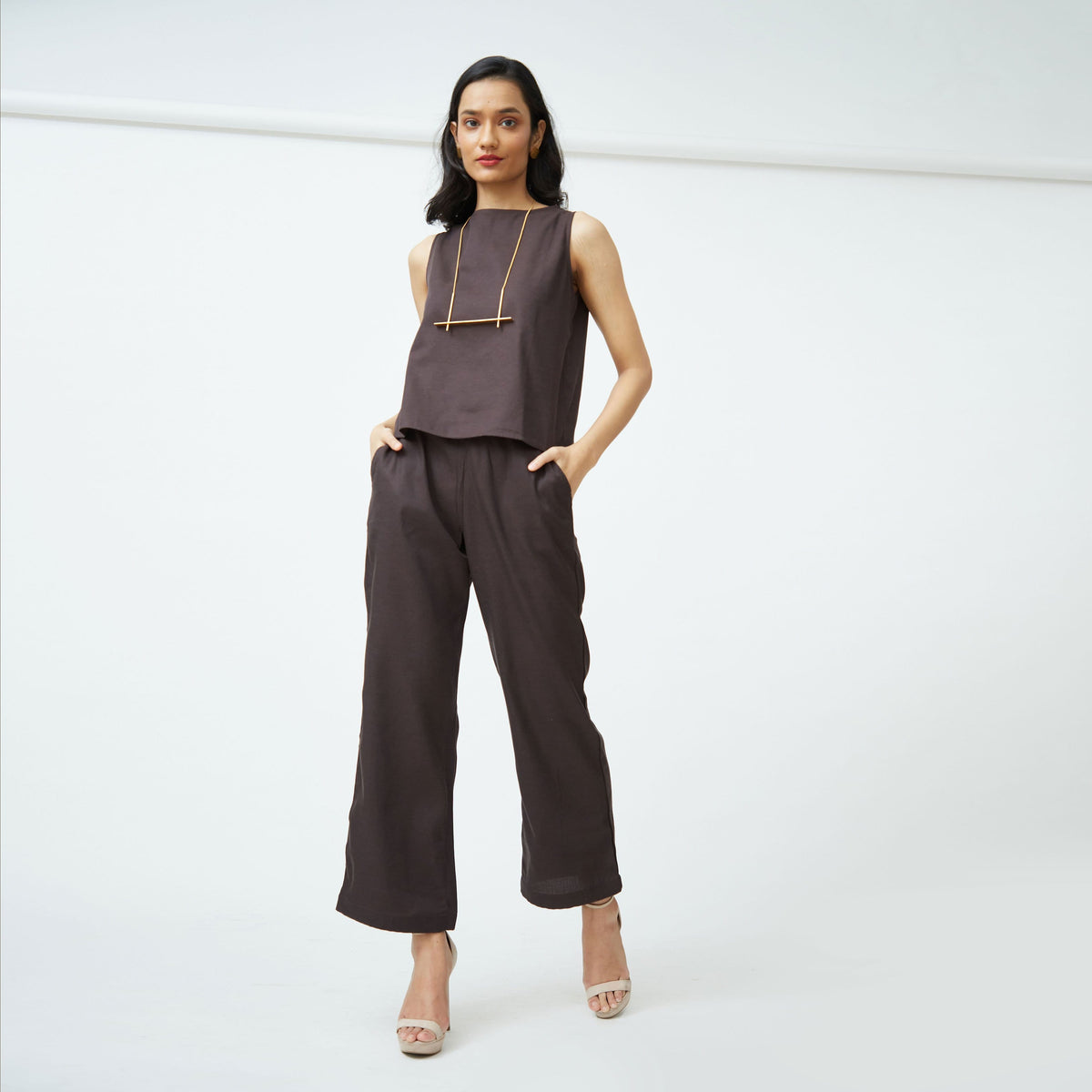 Saltpetre womens western wear in 100% organic cotton set for semi formal, casual, occassional wear. Comfortable, simple and elegant boat neck sleeveless top and ankle length pants in coffee brown.