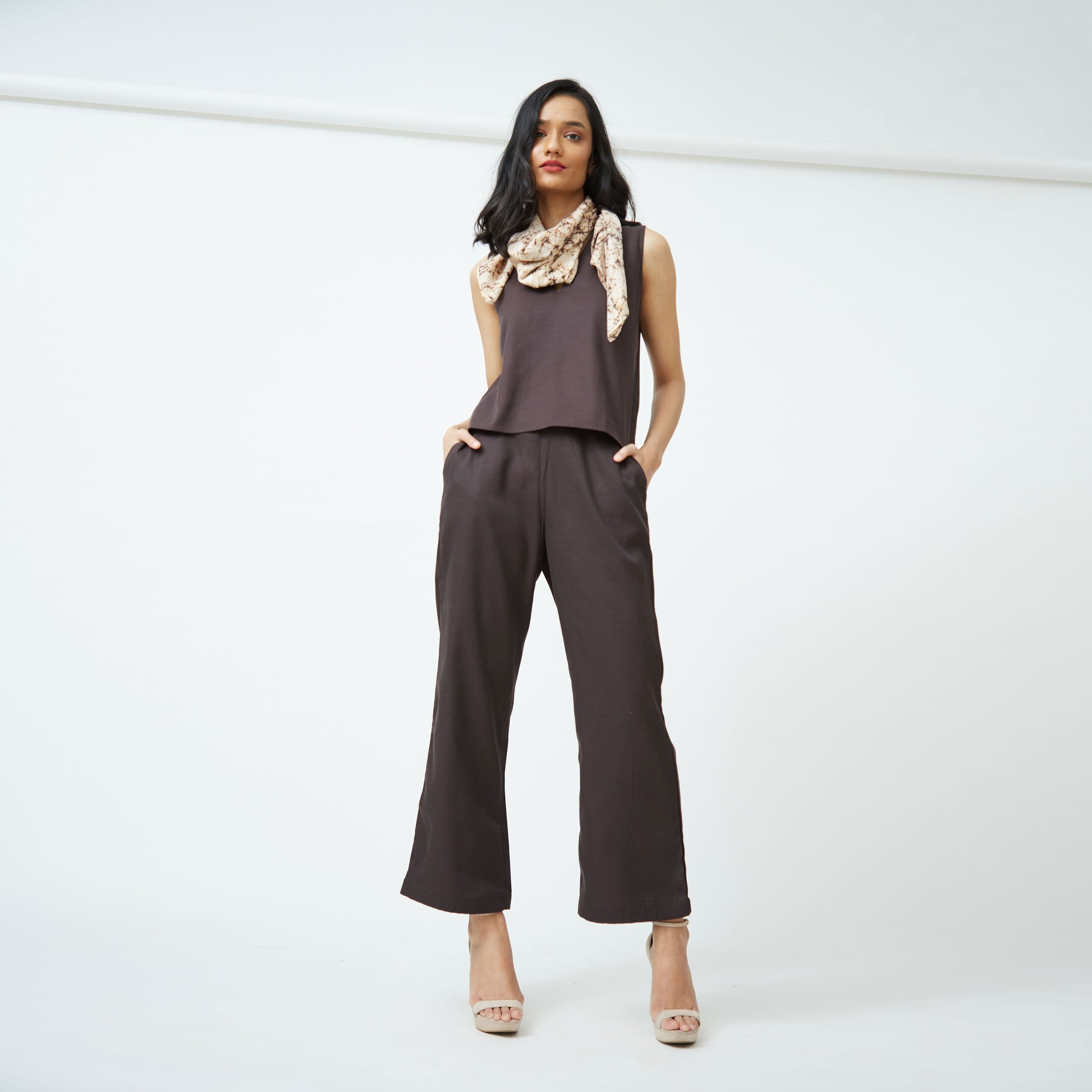 Saltpetre womens wear, indo-western co ord sets for semi formal, casual, occassional wear. Comfortably elegant set of sleeveless top, scarf and ankle length pants in coffee brown colour.
