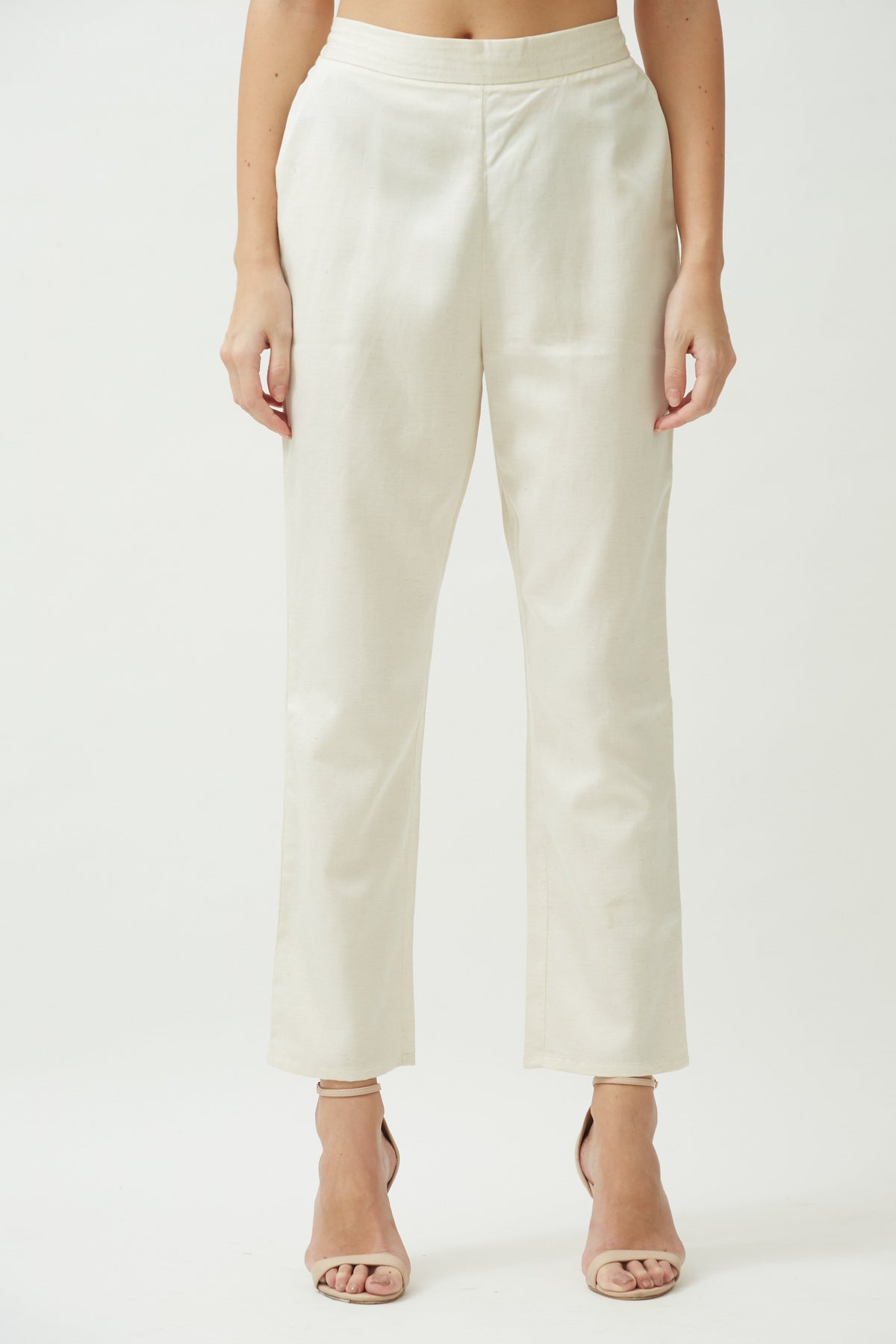 Saltpetre womens wear, indo-western pants for semi formal, casual, occassional wear. Comfortably pencil-shaped ankle-length leg pants in ecru cream white colour. Ankle length, back elastic and side pockets.