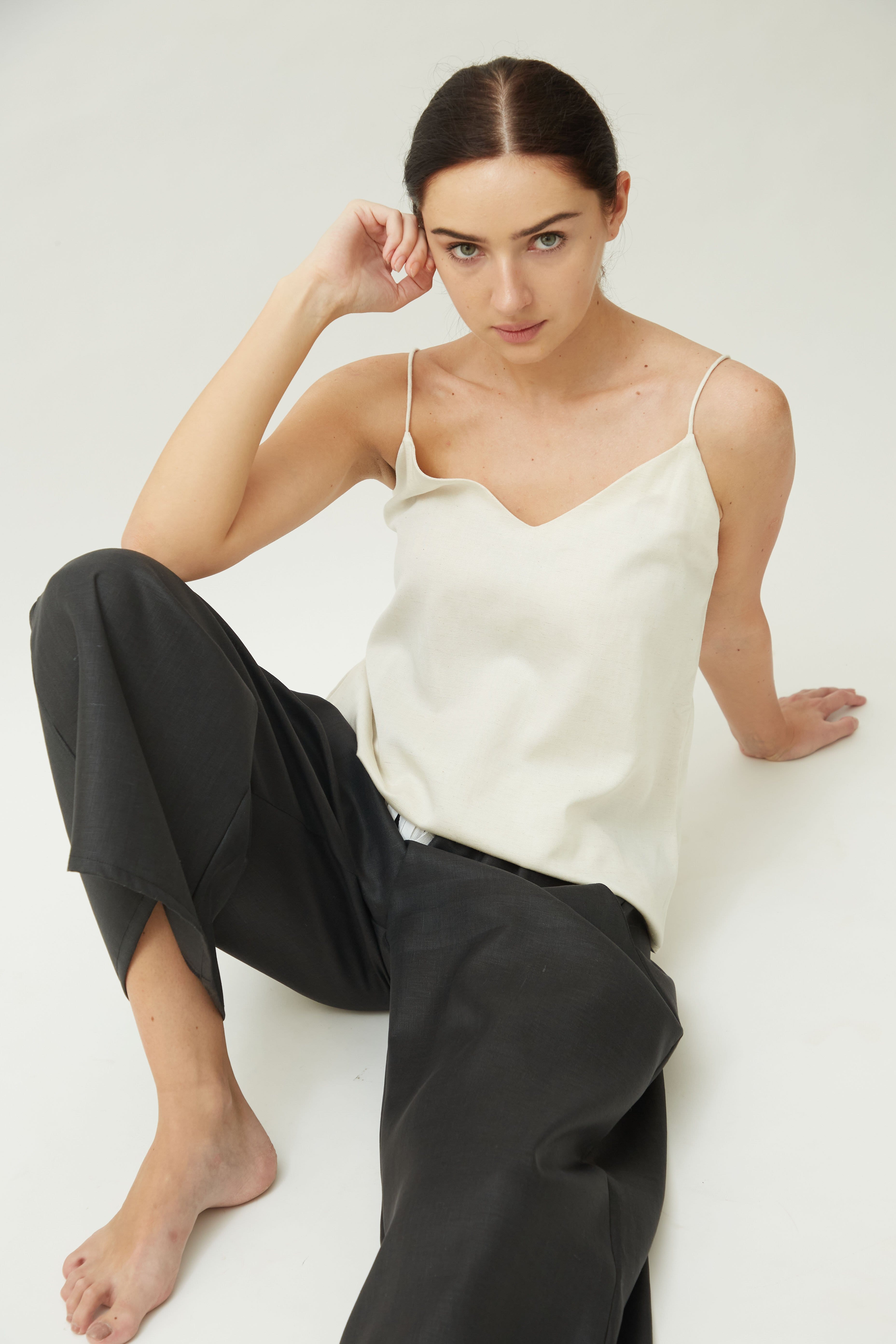 Saltpetre womens casual, outdoors and lounge wear made in organic cotton. White slip top with v-shape neck and black ankle length pants with deep pockets.