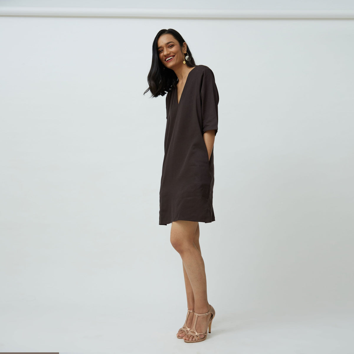 Saltpetre womens wear, indo-western knee length dress for semi formal, casual, occassional wear. Comfortably elegant dress in Coffee brown colour with three quarter sleeves, side slits and side pockets.