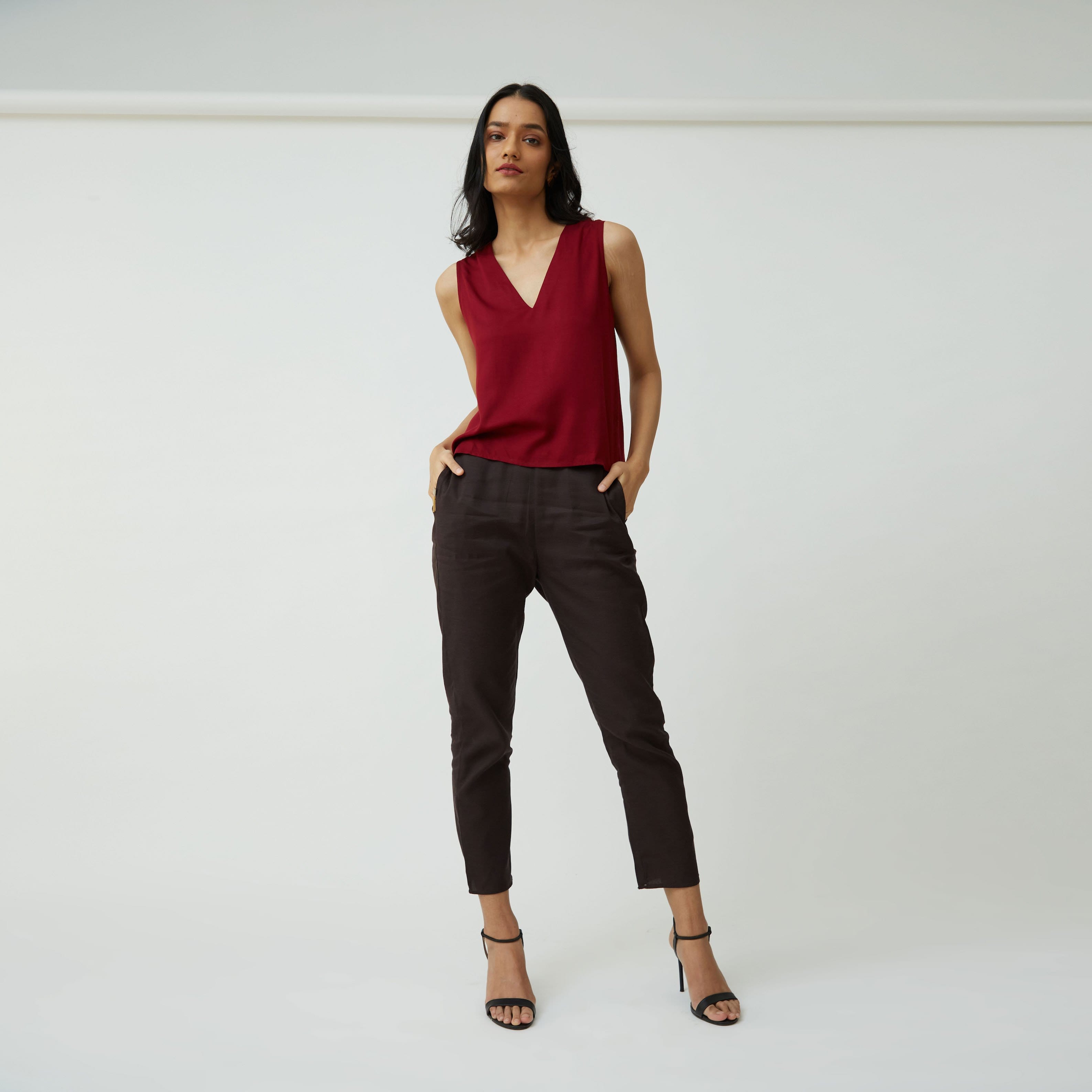 Saltpetre's womens formal, semi-formal, casual and occasion wear in 100% organic cotton. In burgundy brown with a v-shape neck shell top and narrow leg pants with deep side pockets.