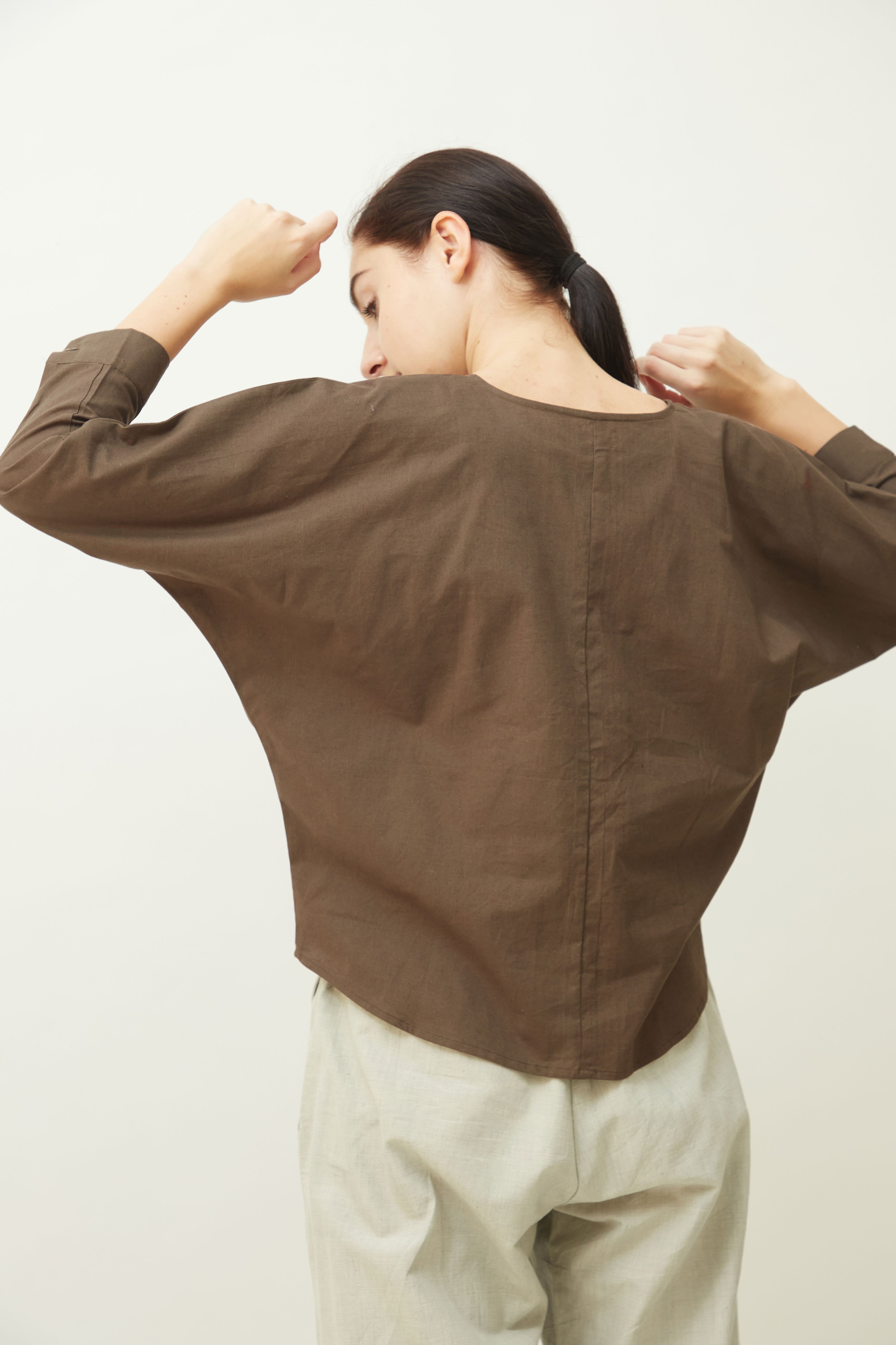 Saltpetre women's semi formal and casual wear in pale blue with high rounded neck and kimono full sleeves. Made from 100% organic cotton and available in all sizes.