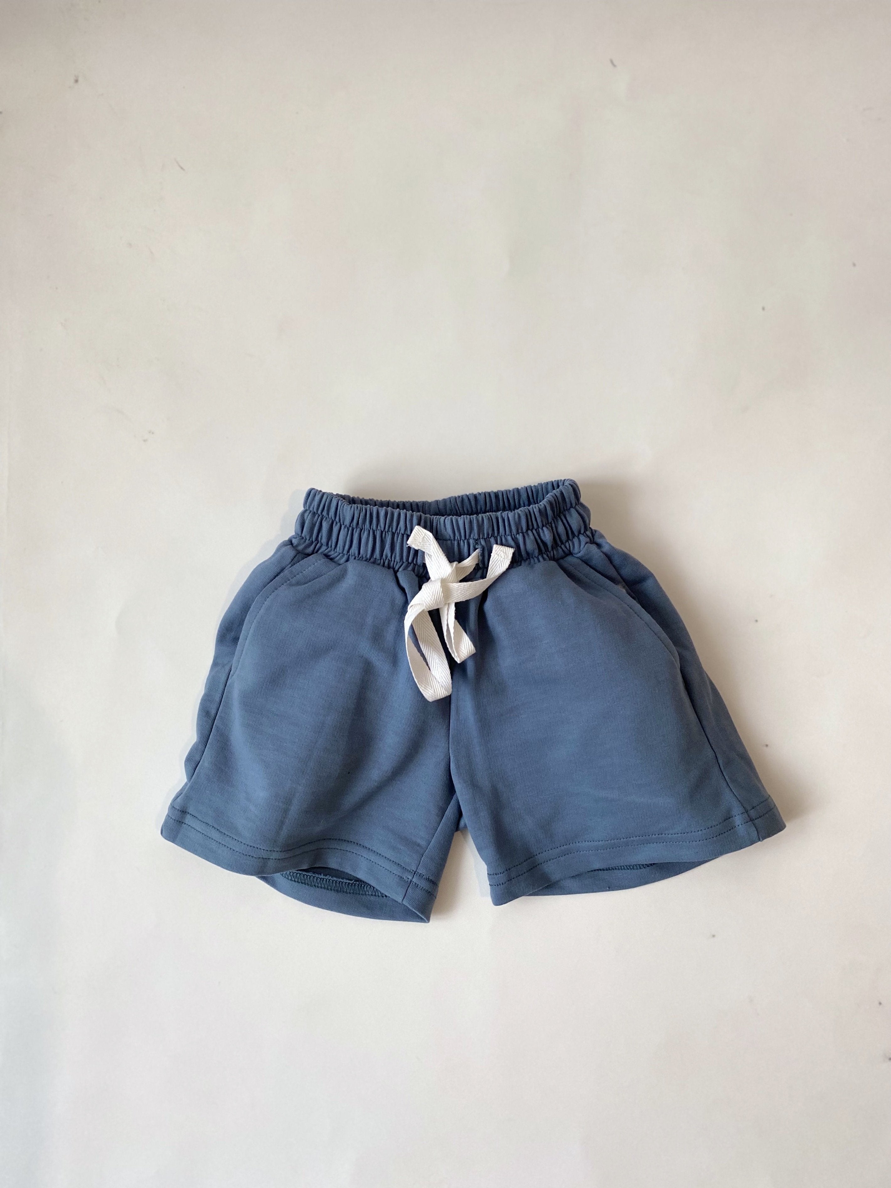 Saltpetre organic, casual unisex kids wear for boy and girls. Shorts with side pockets in blue colour.
