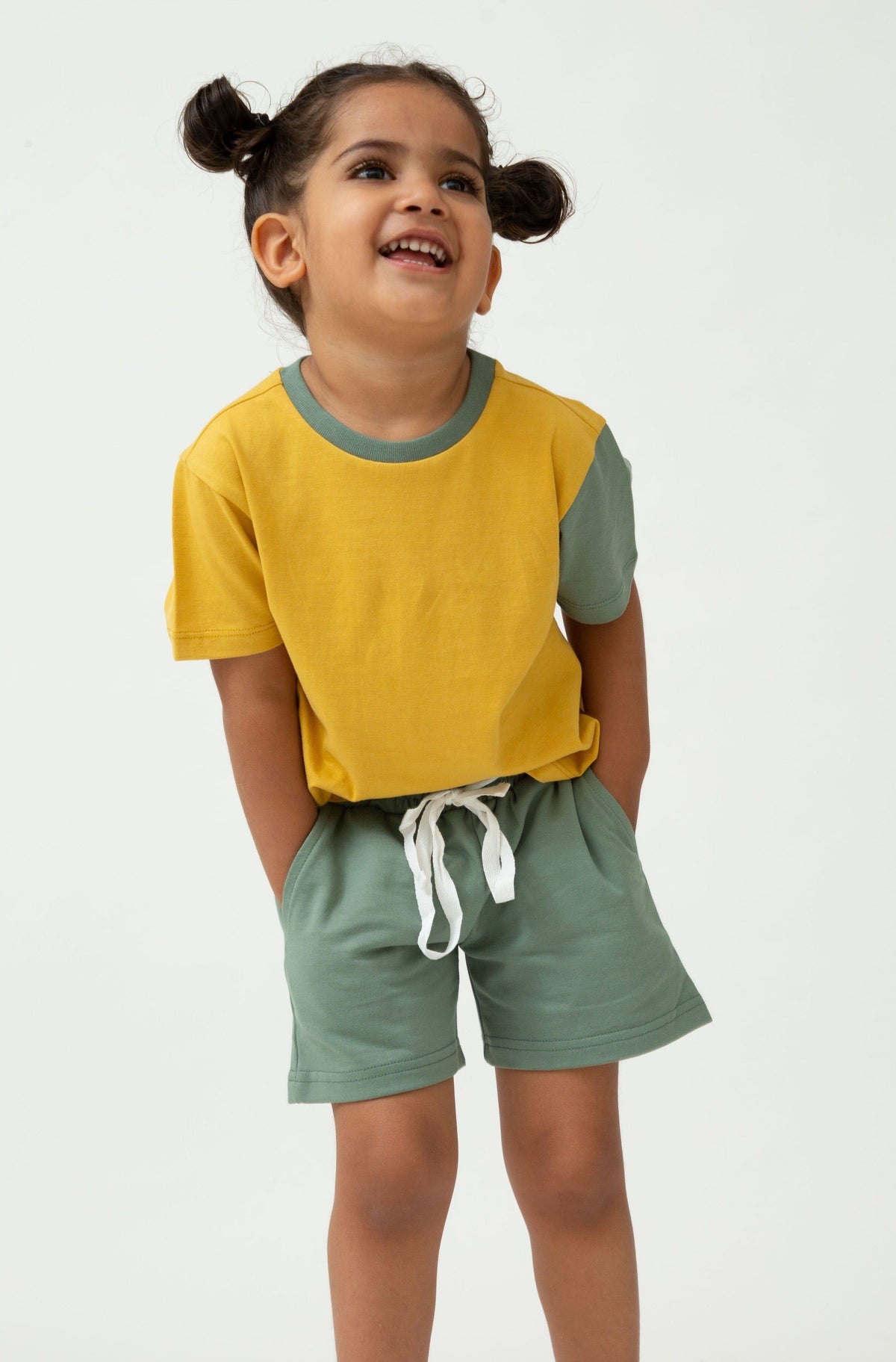 Saltpetre Set of half sleeve yellow t-shirt with green colour blocked sleeve and green pants or shorts with pockets for kids, in combination set, for casual and party wear