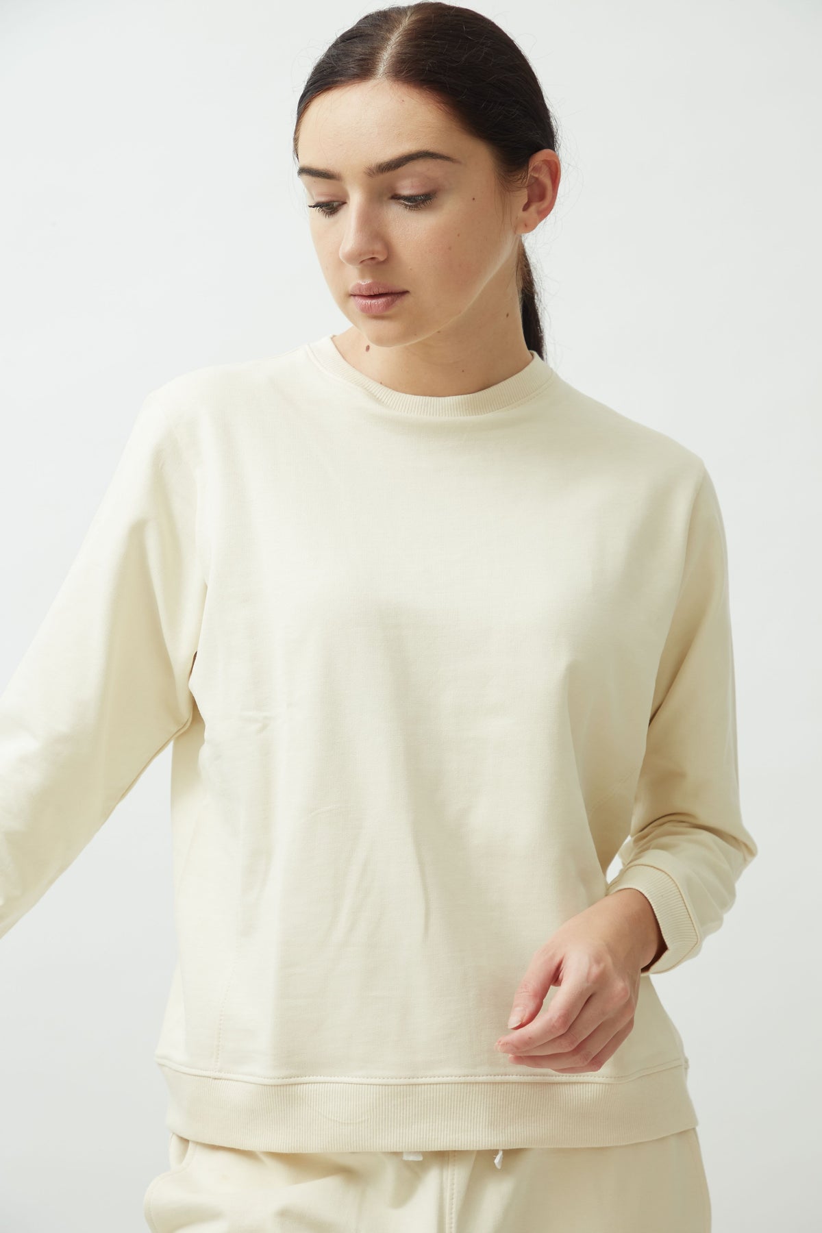 Saltpetre womens wear, lounge wear for casual wear. Comfortable pastel-themed sweatshirt in full sleeves co ord set in terracotta ecru cream colour. Made from 100% organic cotton.