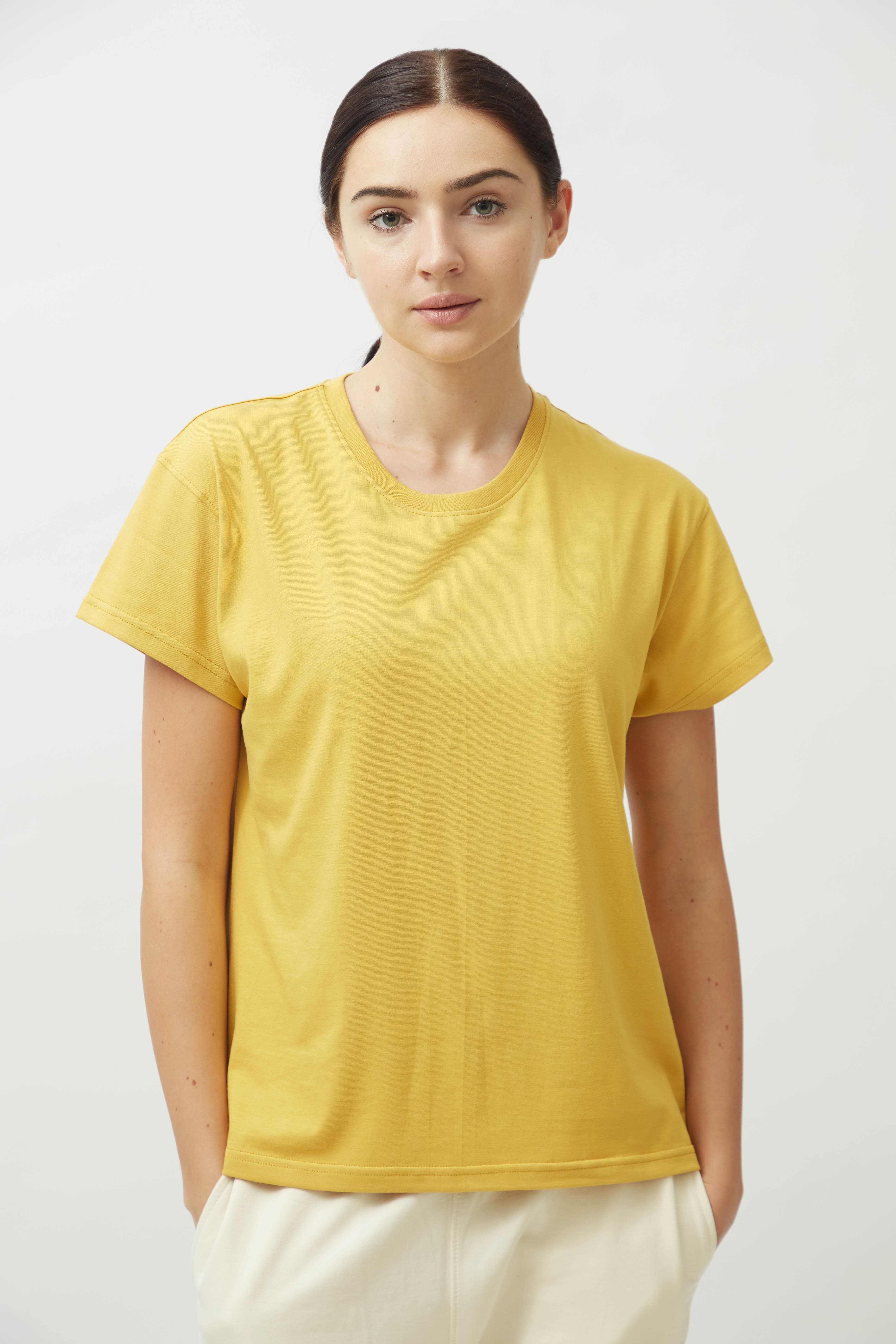 Saltpetre womens wear in bright yellow. Round neck t-shirt with half sleeves for casual and lounge wear. Made out of 100% organic cotton with straight hemline.
