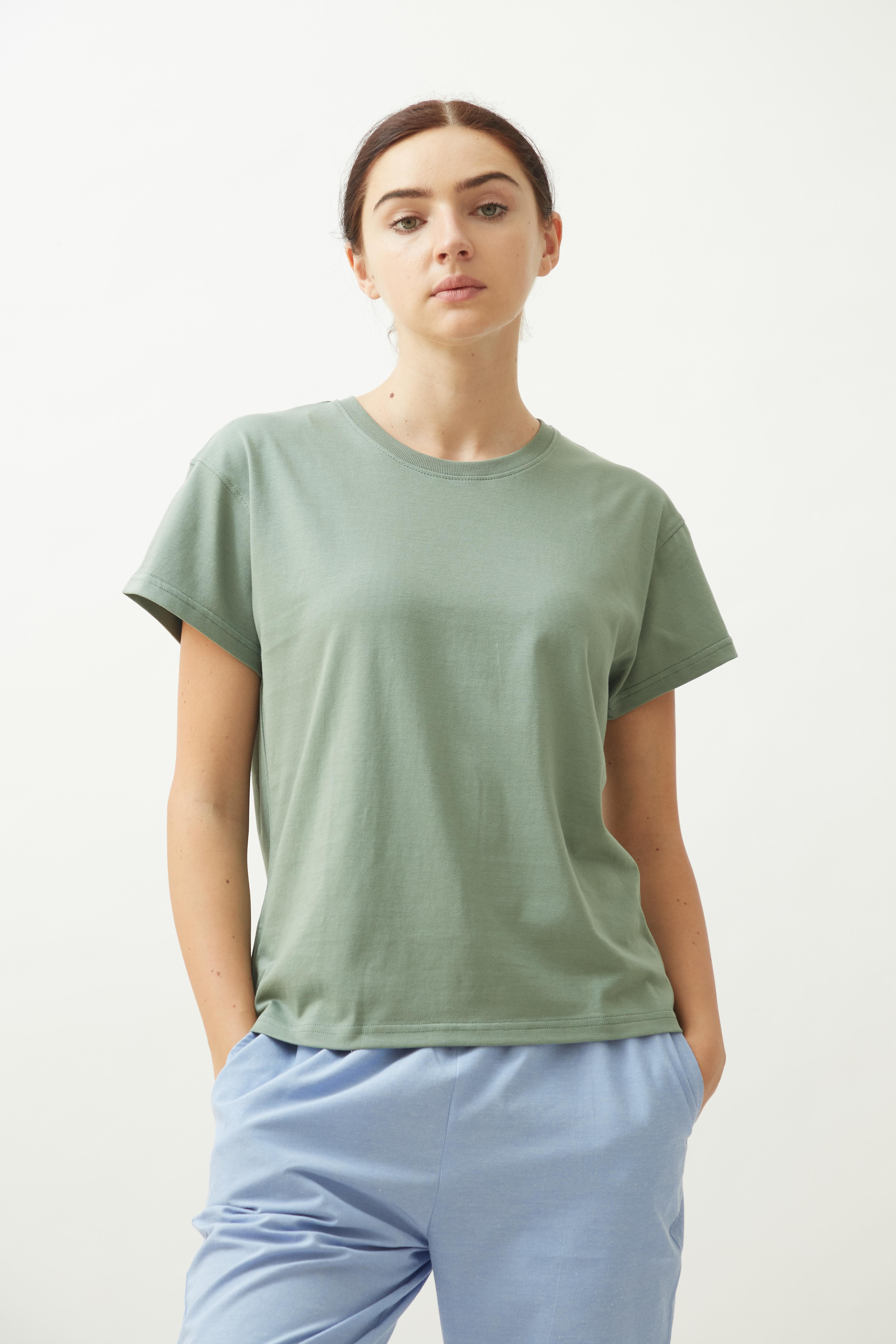 Saltpetre womens wear in sage green. Round neck t-shirt with half sleeves for casual and lounge wear. Made out of 100% organic cotton with straight hemline.